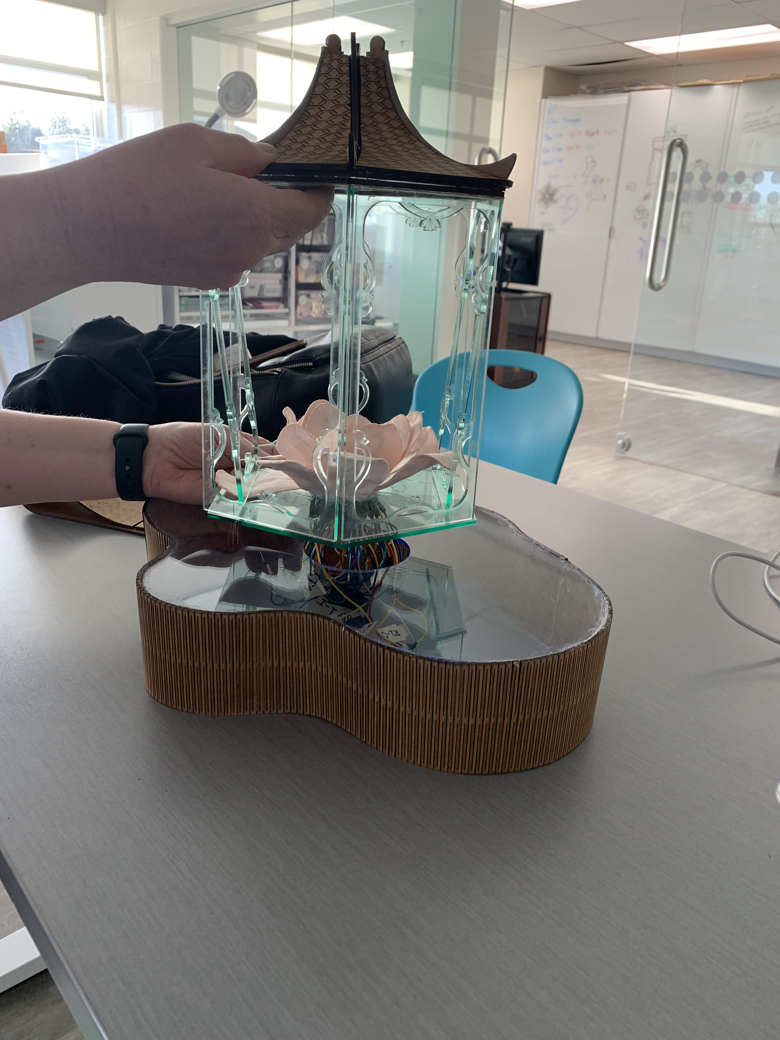 Locked Lotus final touches — lotus lantern with wiring and acrylic pagoda